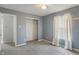Bedroom featuring neutral gray walls, carpet flooring, and a closet at 8631 Belle Union Pl, Indianapolis, IN 46113