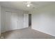 Bedroom featuring neutral walls, carpet flooring, and double door closet at 8631 Belle Union Pl, Indianapolis, IN 46113