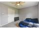 Bedroom featuring neutral walls, carpet flooring, and double door closet at 8631 Belle Union Pl, Indianapolis, IN 46113