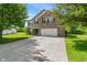 Lovely two-story brick house with a two-car garage and a long driveway at 8631 Belle Union Pl, Indianapolis, IN 46113