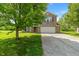 Beautiful two-story brick home with a two-car garage and a well-maintained front yard at 8631 Belle Union Pl, Indianapolis, IN 46113
