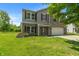 Charming two-story home featuring a brick facade, attached garage, and well-maintained lawn at 8631 Belle Union Pl, Indianapolis, IN 46113