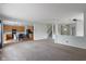 Open-concept living room with views of kitchen, dining area, and staircase at 8631 Belle Union Pl, Indianapolis, IN 46113