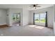 Bright living room featuring plush carpeting, large windows, and neutral paint tones at 8631 Belle Union Pl, Indianapolis, IN 46113