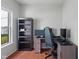 Bright home office with built-in shelving and wood-look flooring at 8631 Belle Union Pl, Indianapolis, IN 46113