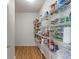 Pantry featuring metal shelving stocked with various food items and household supplies at 8631 Belle Union Pl, Indianapolis, IN 46113