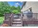 Deck featuring lounge chairs, table and chairs, and a grill with views of the green backyard at 876 Box Turtle Ct, Columbus, IN 47201