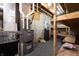 Basement featuring a furnace, gray carpeting, wooden shelves, and walls painted to look like brick at 876 Box Turtle Ct, Columbus, IN 47201