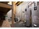 Basement features newer water tanks with visible dates and painted brick-style walls at 876 Box Turtle Ct, Columbus, IN 47201
