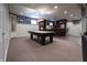 Finished basement featuring a billiards table and built-in bar area with seating at 876 Box Turtle Ct, Columbus, IN 47201