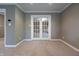 This room features French doors, neutral carpet and paint to allow new owners to customize the space at 876 Box Turtle Ct, Columbus, IN 47201