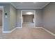 This room features an open doorway, neutral carpet and paint to allow new owners to customize the space at 876 Box Turtle Ct, Columbus, IN 47201