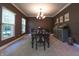 Charming dining room with a classic chandelier, dark wood table, and serene decor creating an inviting space at 876 Box Turtle Ct, Columbus, IN 47201