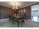 Cozy dining room featuring a chandelier, table set for six, and decorative artwork, perfect for gatherings at 876 Box Turtle Ct, Columbus, IN 47201