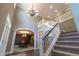 Impressive foyer with high ceilings, staircase, and open view into the dining room, offering an inviting layout at 876 Box Turtle Ct, Columbus, IN 47201