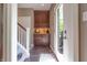 Welcoming foyer featuring tile flooring, a built-in cabinet, and a glass door to the home's exterior at 876 Box Turtle Ct, Columbus, IN 47201