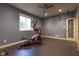 Finished basement home gym with ceiling fan, rubber flooring and exercise equipment at 876 Box Turtle Ct, Columbus, IN 47201