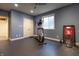 Finished basement home gym with ceiling fan, rubber flooring and exercise equipment at 876 Box Turtle Ct, Columbus, IN 47201