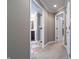 Hallway with neutral paint and carpet provides a view into the adjacent bathroom at 876 Box Turtle Ct, Columbus, IN 47201
