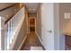 Hallway with tiled floors and a staircase, leading to various rooms and showcasing the home's layout at 876 Box Turtle Ct, Columbus, IN 47201