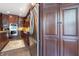 Elegant kitchen features stainless steel refrigerator, and beautiful wooden cabinetry at 876 Box Turtle Ct, Columbus, IN 47201