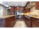 This open concept kitchen is equipped with stainless steel appliances, custom cabinets, and granite countertops at 876 Box Turtle Ct, Columbus, IN 47201