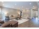 Bright living room with neutral color scheme, recessed lighting, and tile flooring at 876 Box Turtle Ct, Columbus, IN 47201