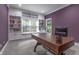 Bright office with built-in shelving, window seating, and dark wood desk at 876 Box Turtle Ct, Columbus, IN 47201
