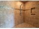 Elegant tiled shower showcasing modern fixtures and a built-in niche for toiletries at 876 Box Turtle Ct, Columbus, IN 47201