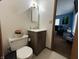This bathroom features a gray vanity and a toilet at 8936 E 46Th St, Indianapolis, IN 46226