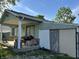This home has a cozy front porch, adding curb appeal and outdoor living space at 8936 E 46Th St, Indianapolis, IN 46226