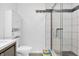 Well-lit bathroom features white cabinets, modern fixtures, and shower with glass door at 9229 Crossing Dr, Fishers, IN 46037