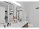 Bathroom featuring double vanity, stylish mirrors and lighting, and modern fixtures at 9229 Crossing Dr, Fishers, IN 46037