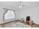 Bright bedroom with a ceiling fan, large window, and playmat on the floor at 9229 Crossing Dr, Fishers, IN 46037