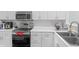 Contemporary kitchen features stainless steel appliances, ample counter space, and white cabinets at 9229 Crossing Dr, Fishers, IN 46037