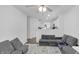 Open-concept living room with comfortable gray sofas and an inviting atmosphere at 9229 Crossing Dr, Fishers, IN 46037