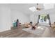 Expansive living area with hardwood floors, skylights, and bright natural light, creating a comfortable and welcoming space at 9229 Crossing Dr, Fishers, IN 46037