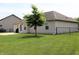 Well-maintained backyard featuring a patio, manicured lawn, and vinyl siding at 994 Young'S Creek Dr, Franklin, IN 46131