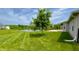 Fenced backyard overlooks a serene pond view at 994 Young'S Creek Dr, Franklin, IN 46131