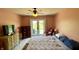 Bedroom with a ceiling fan and french doors that lead to the backyard at 994 Young'S Creek Dr, Franklin, IN 46131
