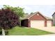 Charming brick home features an attached two car garage and well manicured lawn at 994 Young'S Creek Dr, Franklin, IN 46131