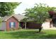 Brick exterior home with an attached garage is complemented by well-manicured lawn at 994 Young'S Creek Dr, Franklin, IN 46131