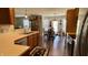Open concept kitchen and dining area has wood cabinets and stainless appliances at 994 Young'S Creek Dr, Franklin, IN 46131