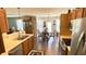 Open kitchen and dining area features stainless steel appliances and wood cabinets at 994 Young'S Creek Dr, Franklin, IN 46131