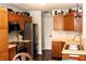 Kitchen with stainless steel appliances and wood cabinets at 994 Young'S Creek Dr, Franklin, IN 46131