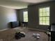 Spacious bedroom featuring two windows, neutral paint, and plenty of natural light at 10803 Gathering Dr, Indianapolis, IN 46259