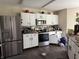 Well-equipped kitchen with stainless steel appliances, ample counter space, and sleek cabinetry at 10803 Gathering Dr, Indianapolis, IN 46259