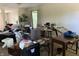Cozy living room features a large window, hardwood floors, and ample natural light at 10803 Gathering Dr, Indianapolis, IN 46259
