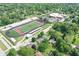 Aerial shot showcasing a neighborhood near a school with a football field and track at 1101 E Loretta Dr, Indianapolis, IN 46227
