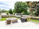 Well-maintained backyard featuring a wooden deck with patio furniture, a shed, and lush greenery at 1101 E Loretta Dr, Indianapolis, IN 46227